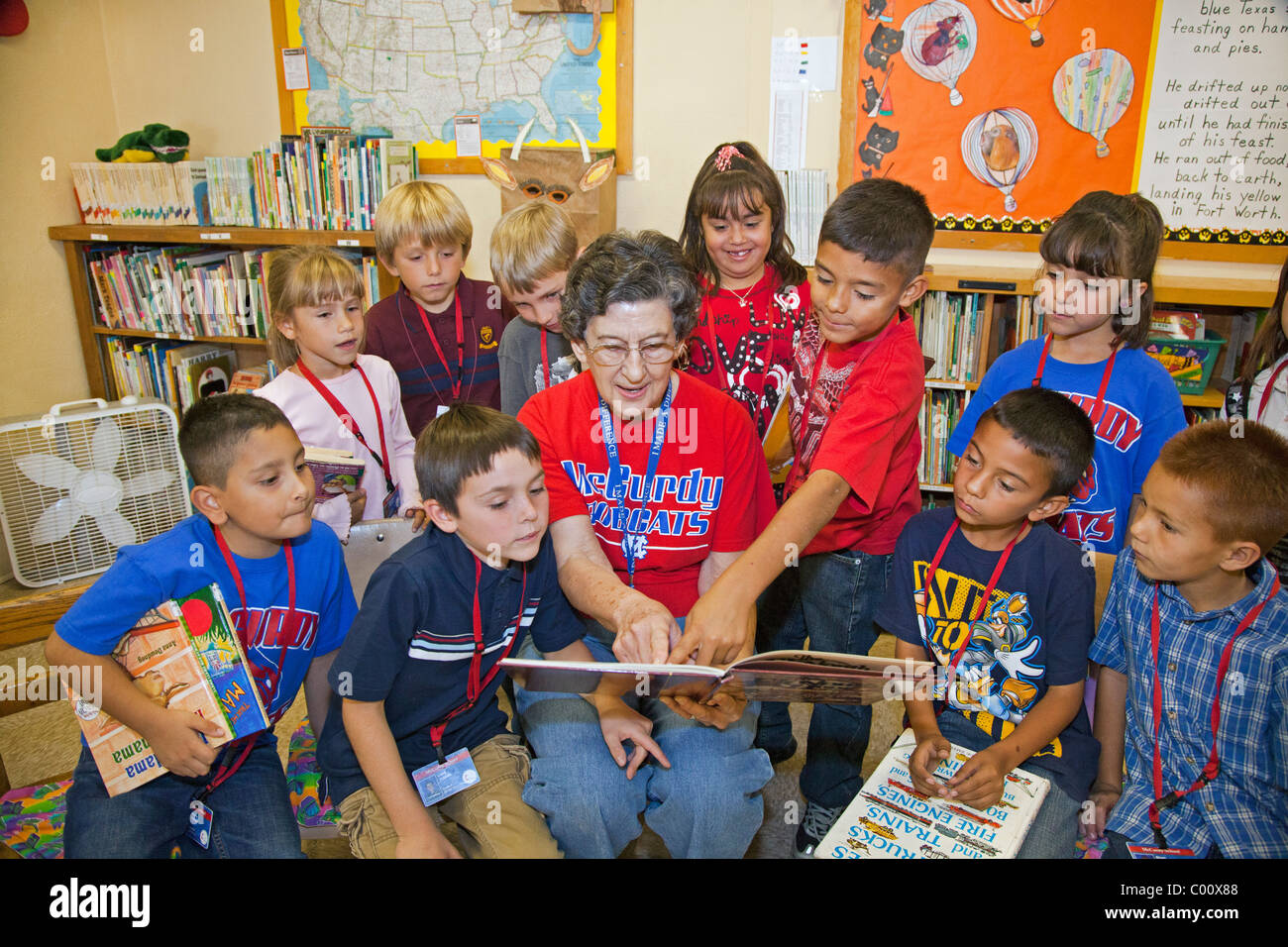 Volunteer Reads to Second Graders Stock Photo