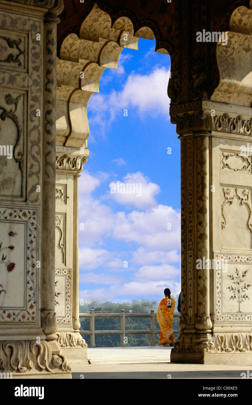 India, Uttar Pradesh, Agra, Red fort complex & lady in traditional sari Stock Photo