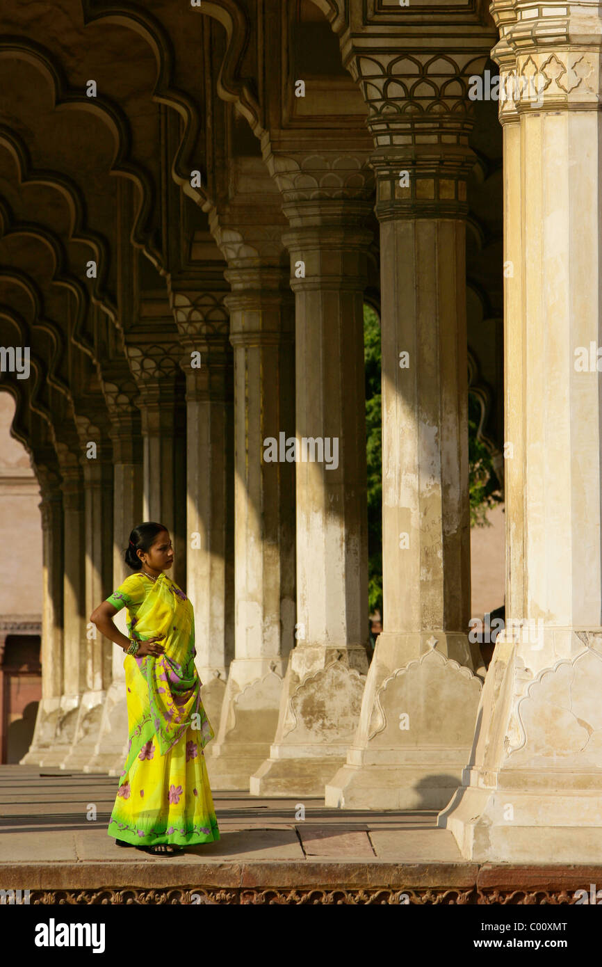 India, Uttar Pradesh, Agra, Lady in yellow sari inside Red fort complex Stock Photo