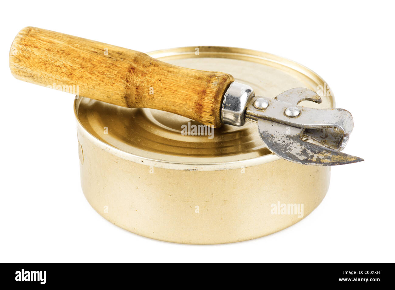 Old dirty tin can opener with wooden handle and closed food tin can on white background Stock Photo