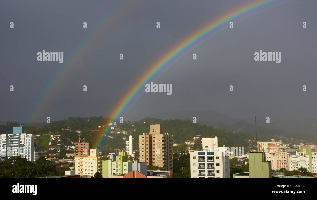 Double rainbow over the city Stock Photo - Alamy