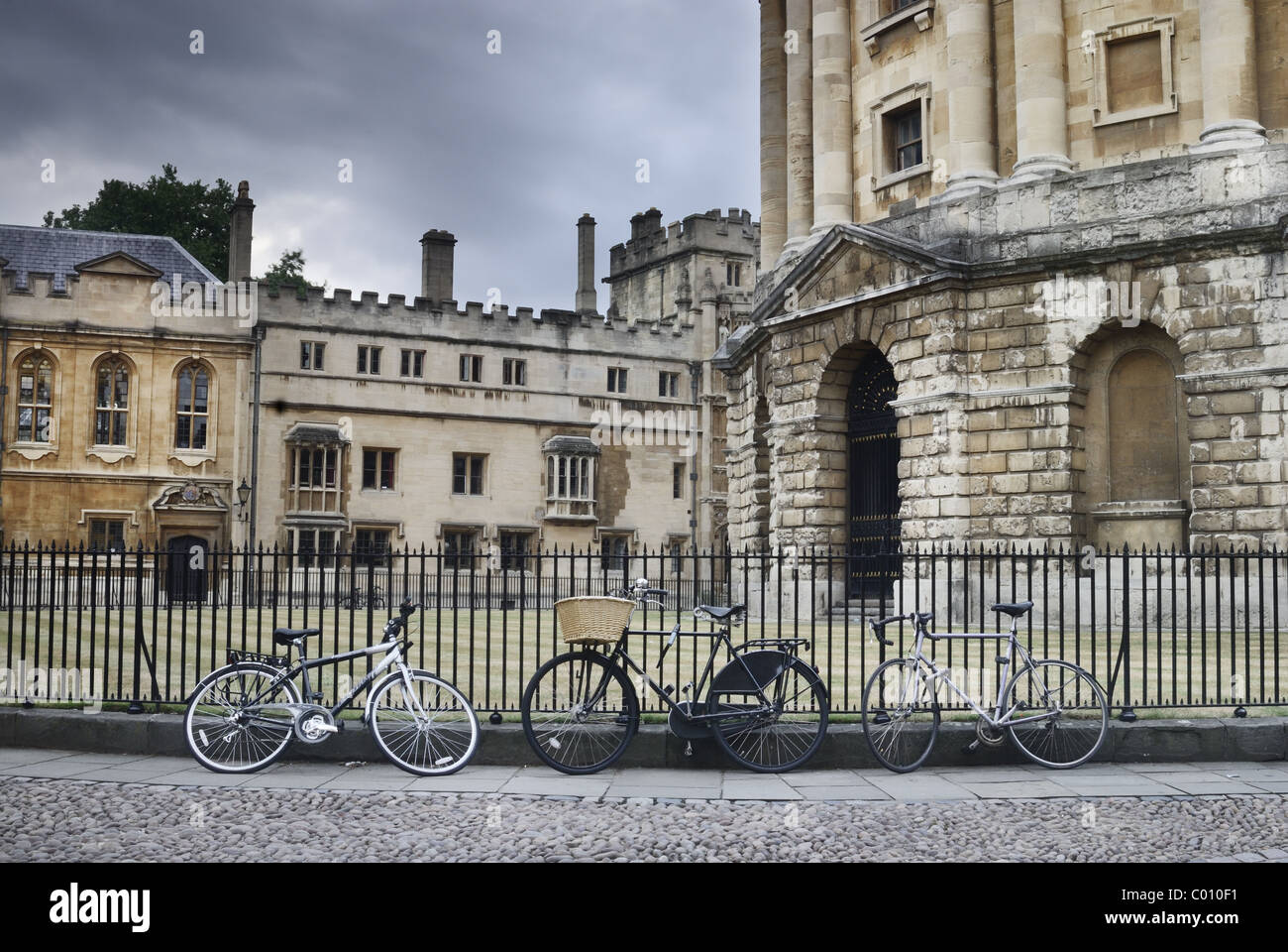 Bicycles locked against railings in Radcliffe Square, Oxford, oxfordshire,england,uk Stock Photo