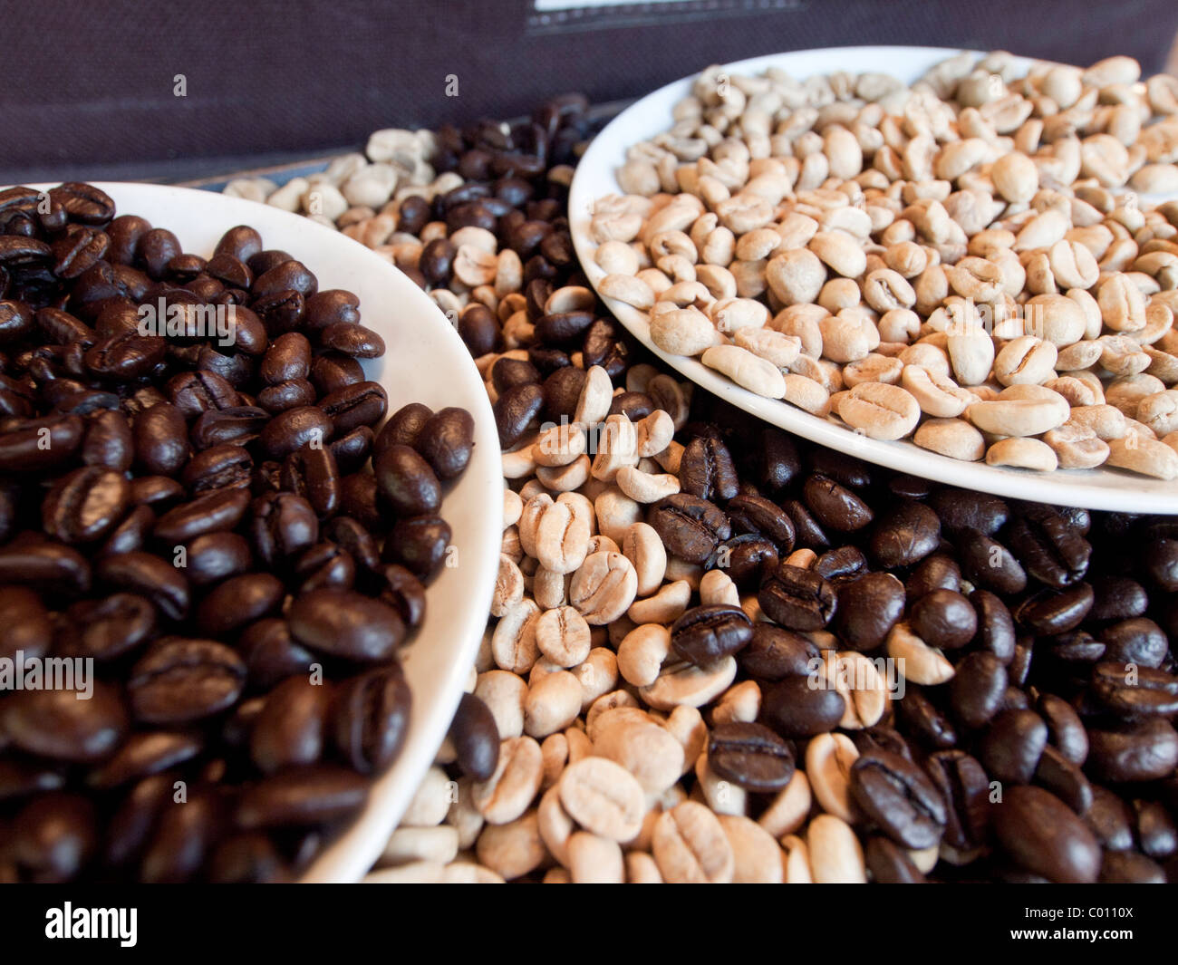 Coffee beans before and after roasting Stock Photo Alamy