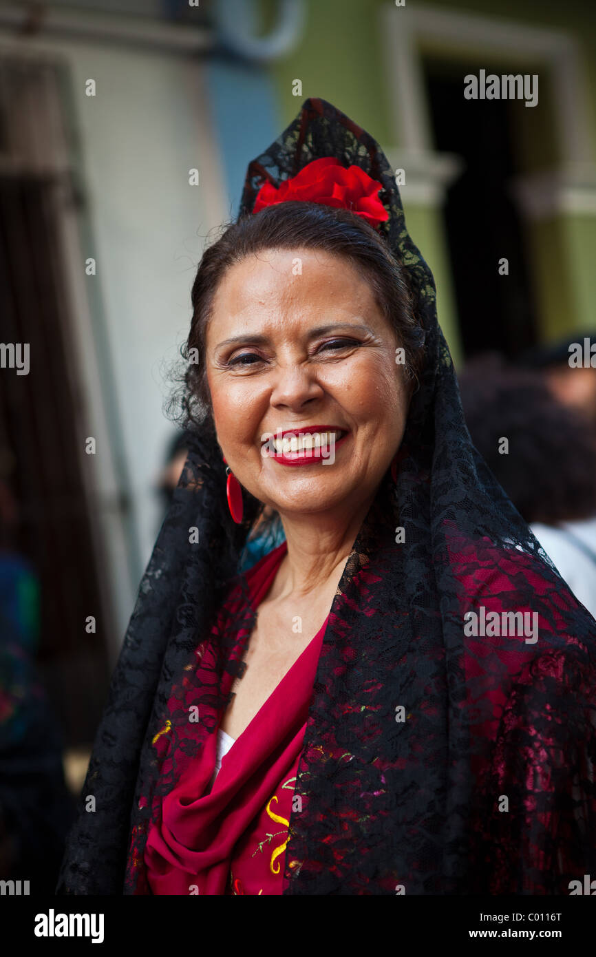 A woman dressed in traditional Puerto Rican costume at the Festival of San Sebastian in San Juan, Puerto Rico. Stock Photo