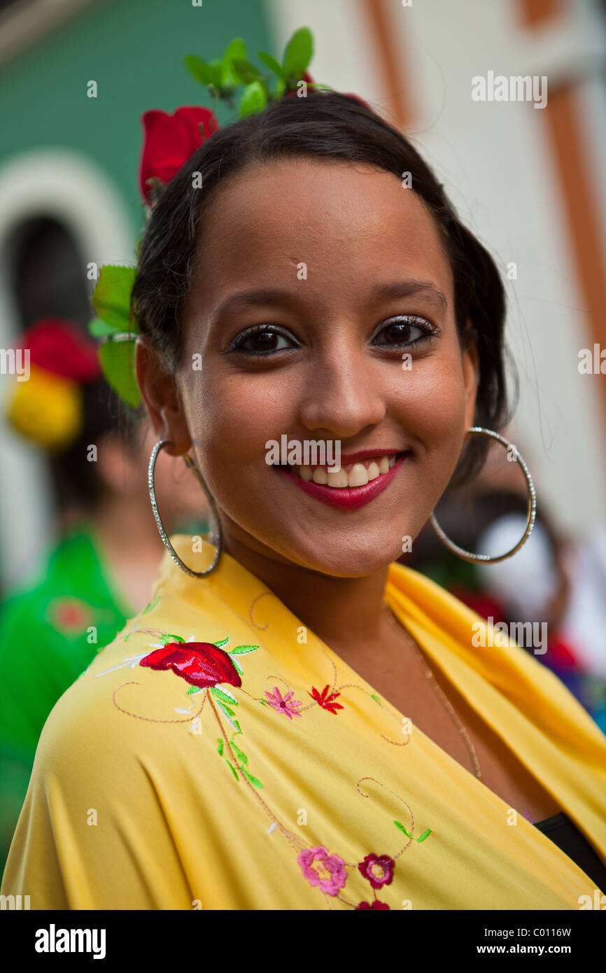 A young woman dressed in traditional Puerto Rican costume at the Festival of San Sebastian in San Juan, Puerto Rico. Stock Photo