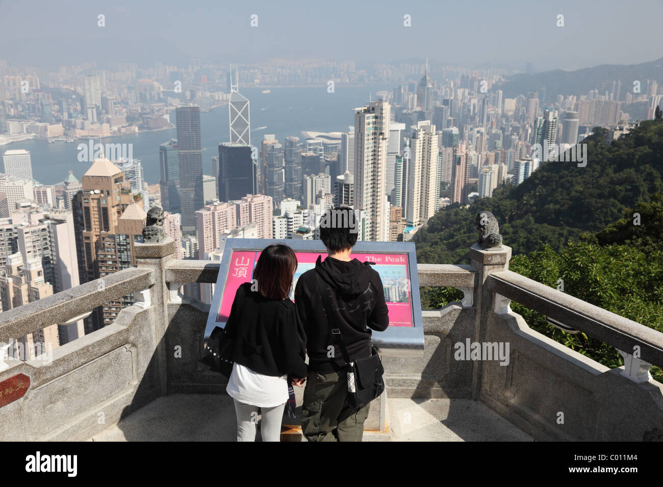 Couple enjoying the view over Hong Kong from Victoria Peak Stock Photo ...