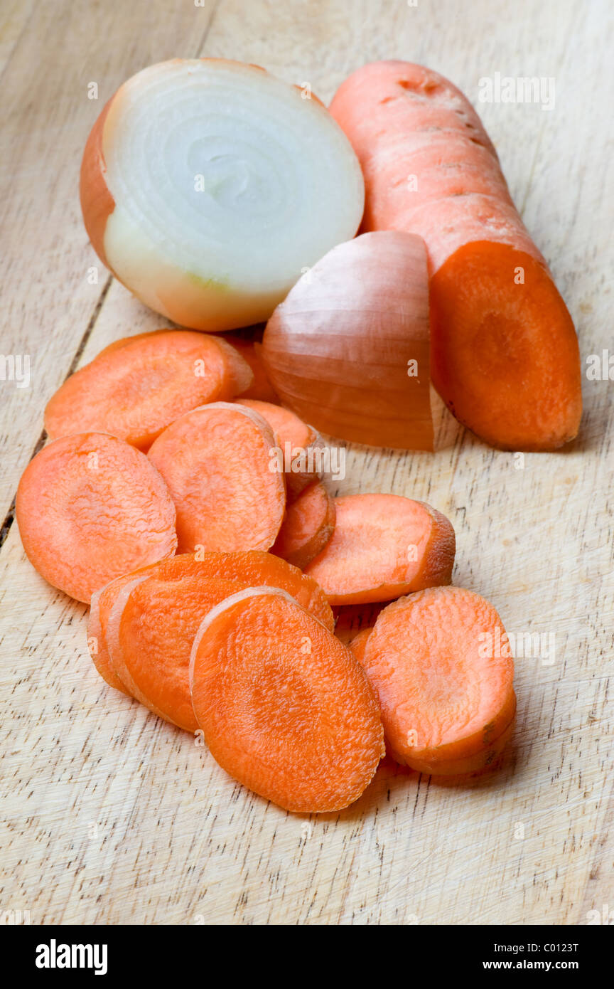object on white - carrot on a cutting board Stock Photo