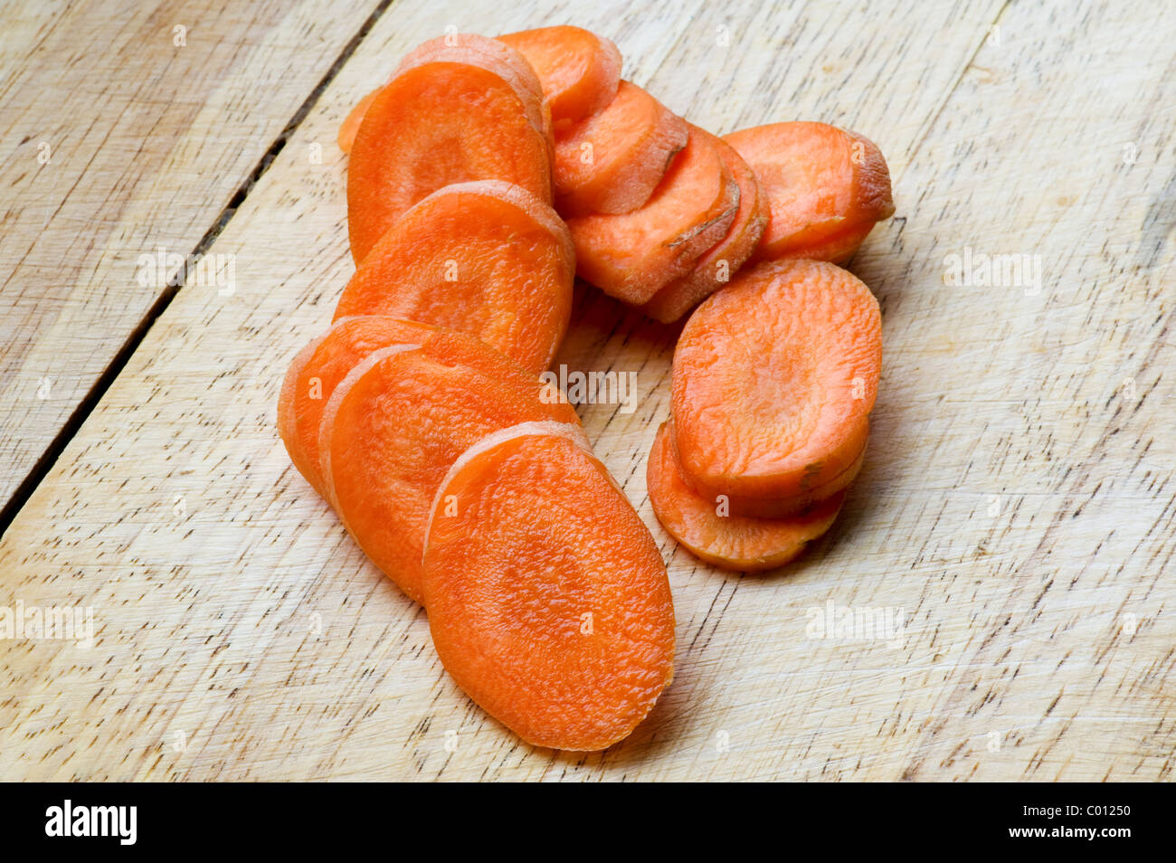 object on white - carrot on a cutting board Stock Photo
