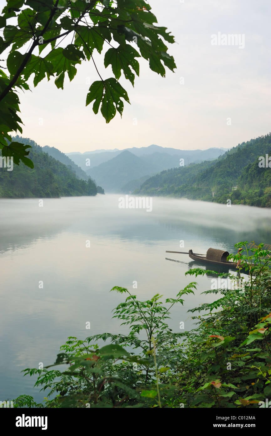 Fishing boat on the foggy river, photo taken in hunan province of China Stock Photo