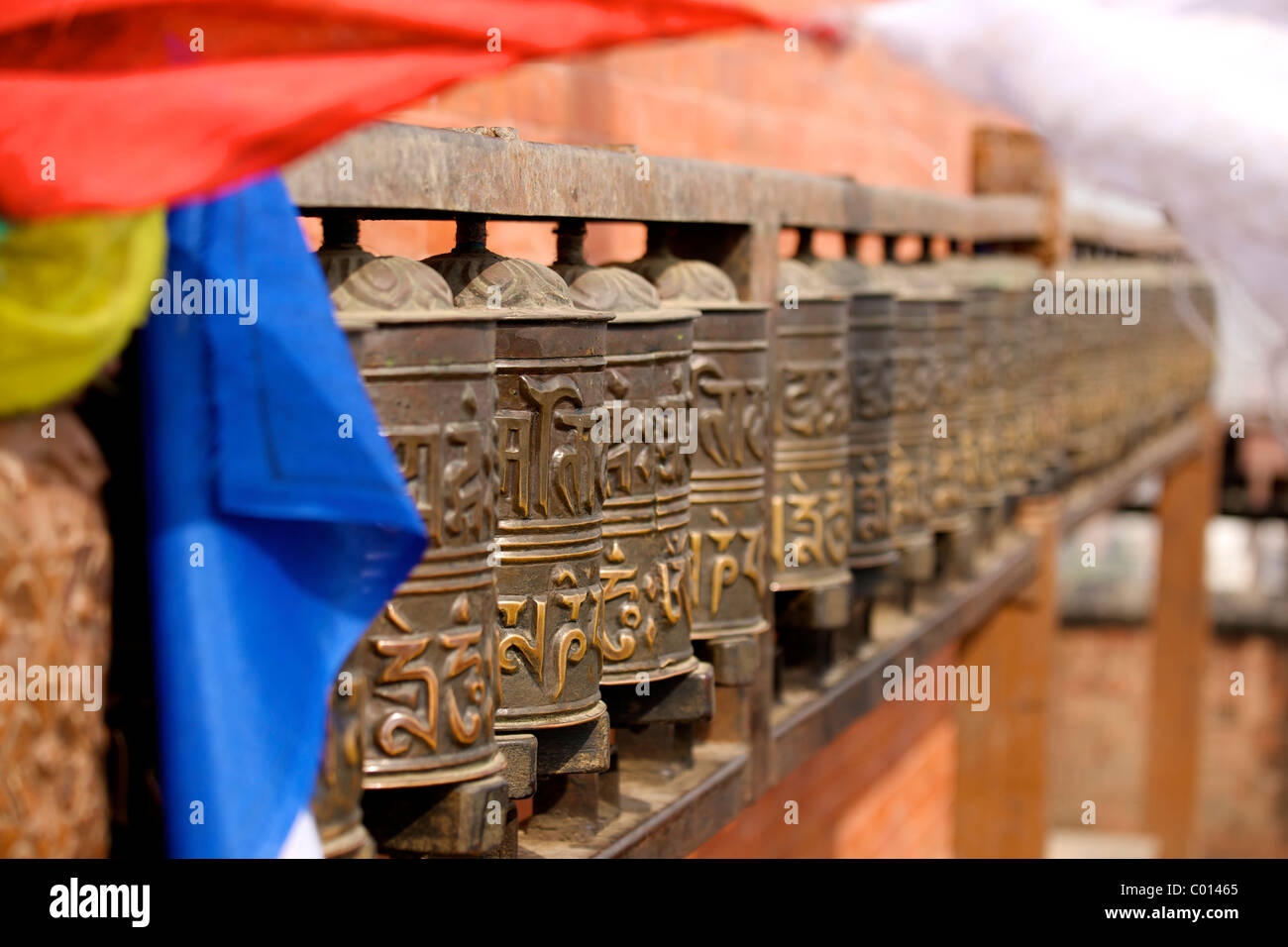 Buddhist prayer wheels on the exterior wall of the Swayambhunath Stupa ...