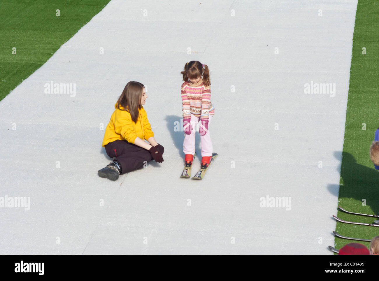 Child learning to Ski on a dry Ski slope in Plymouth Devon England Stock Photo