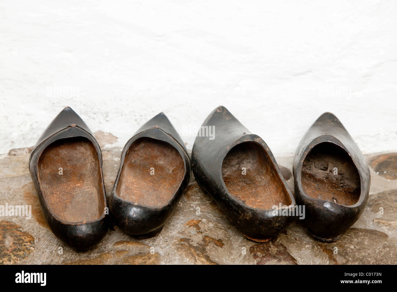 Two pairs of wooden shoes Stock Photo