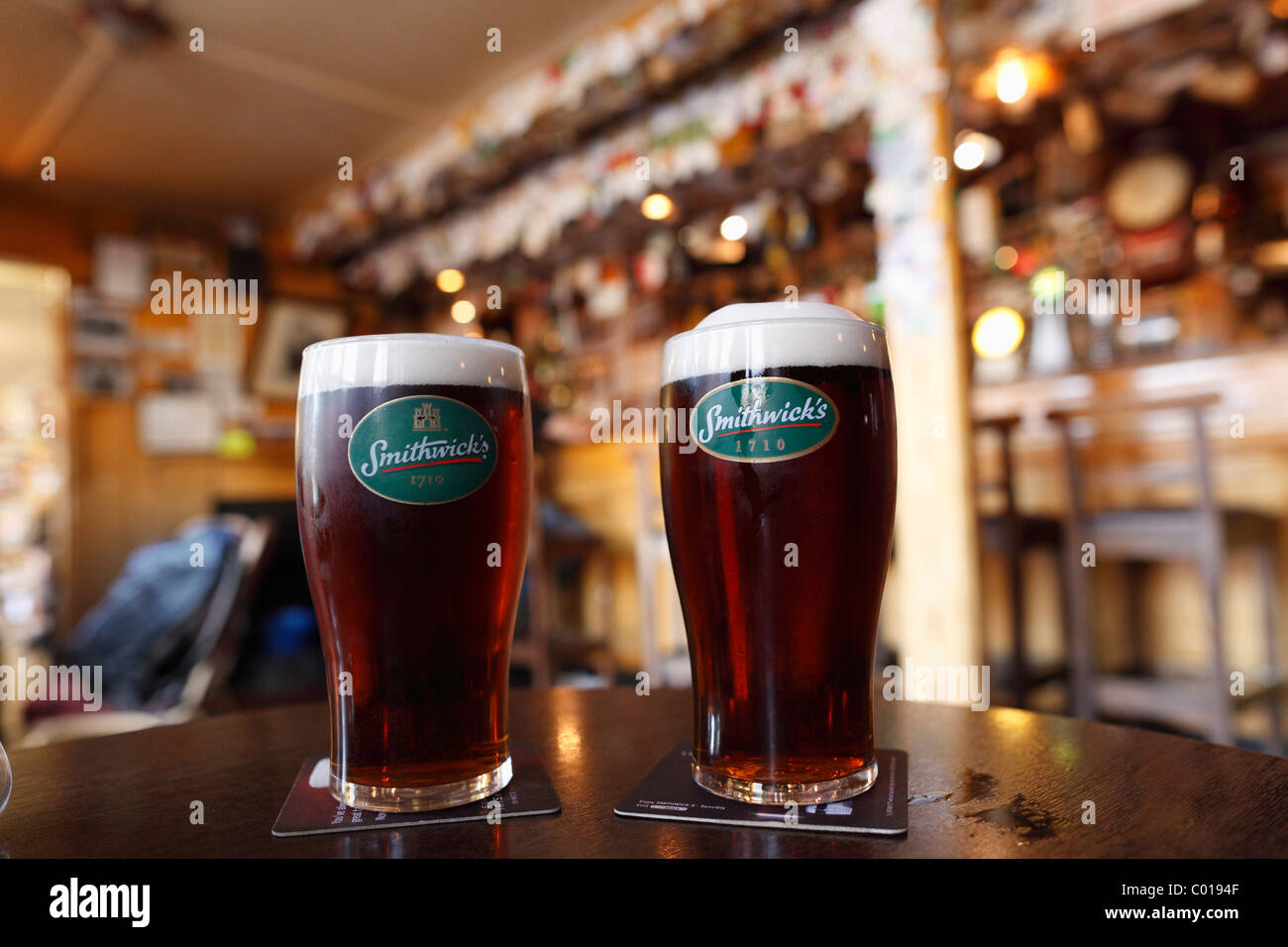 https://c8.alamy.com/comp/C0194F/two-glasses-of-smithwicks-stout-beer-in-a-pub-in-shannonbridge-county-C0194F.jpg