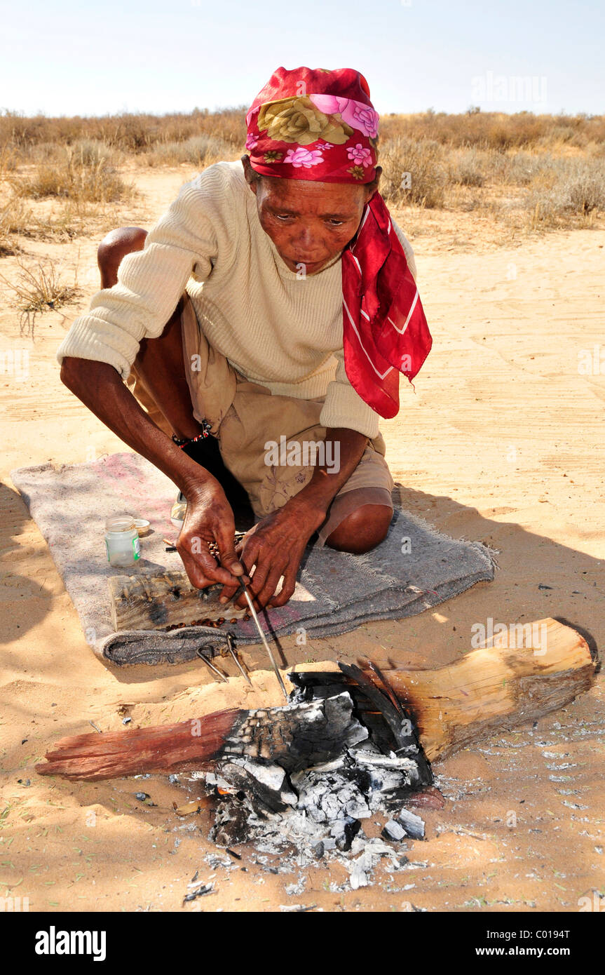 San woman making handicrafts, Kgalagadi Transfrontier Park, Kalahari, South Africa, Africa Stock Photo