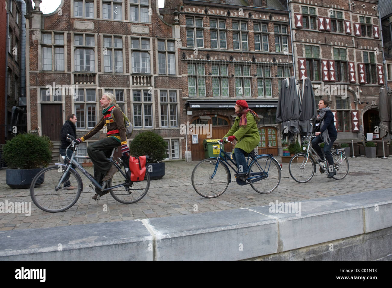 Ghent in East Flanders-Oost-Vlaanderen, Belgium. The Historic Old Centre. Cycling along the Graslei. Stock Photo