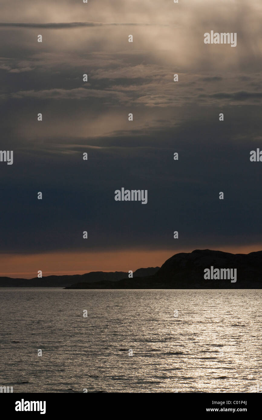Reflections of the sun at dusk, Rodoyfjorden, Norway, Scandinavia, Europe Stock Photo