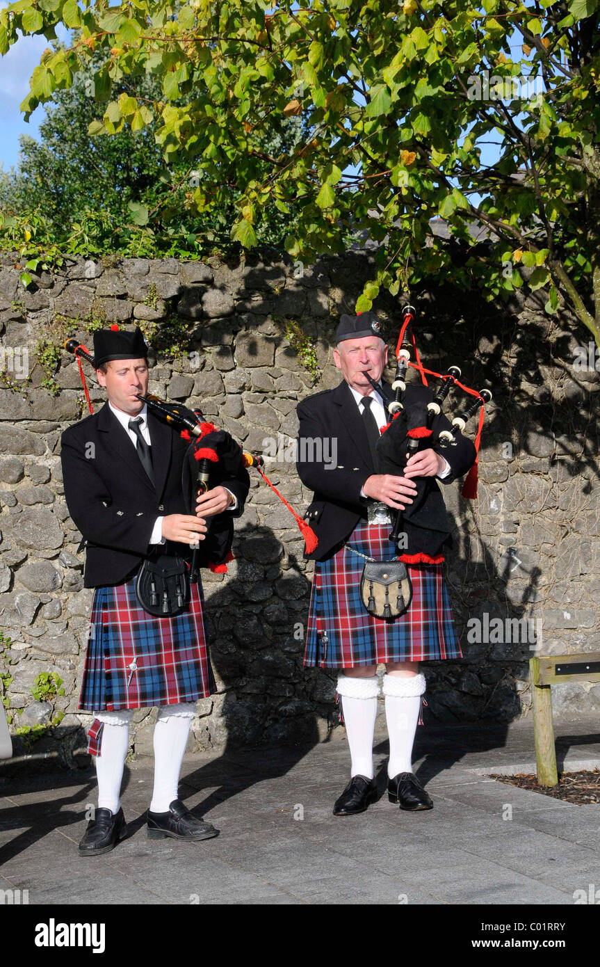 Irish men wearing kilts and playing bagpipes at the Fleadh Cheoil 2009, the largest festival of traditional music in Tullamore Stock Photo