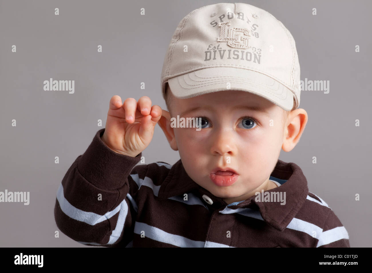 Baby with cap, boy, 8 months, portrait Stock Photo