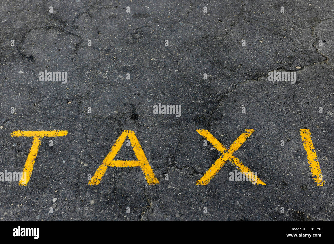 Word 'taxi' on the asphalt Stock Photo