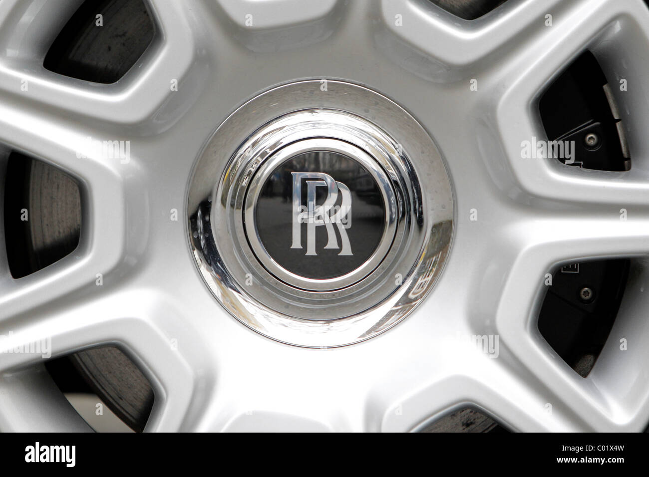 A Rolls Royce badge on a car wheel Stock Photo