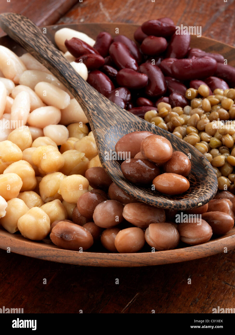 A bowl of beans red kidney lentils butter beans borlotti chick peas garbanzo beans Stock Photo
