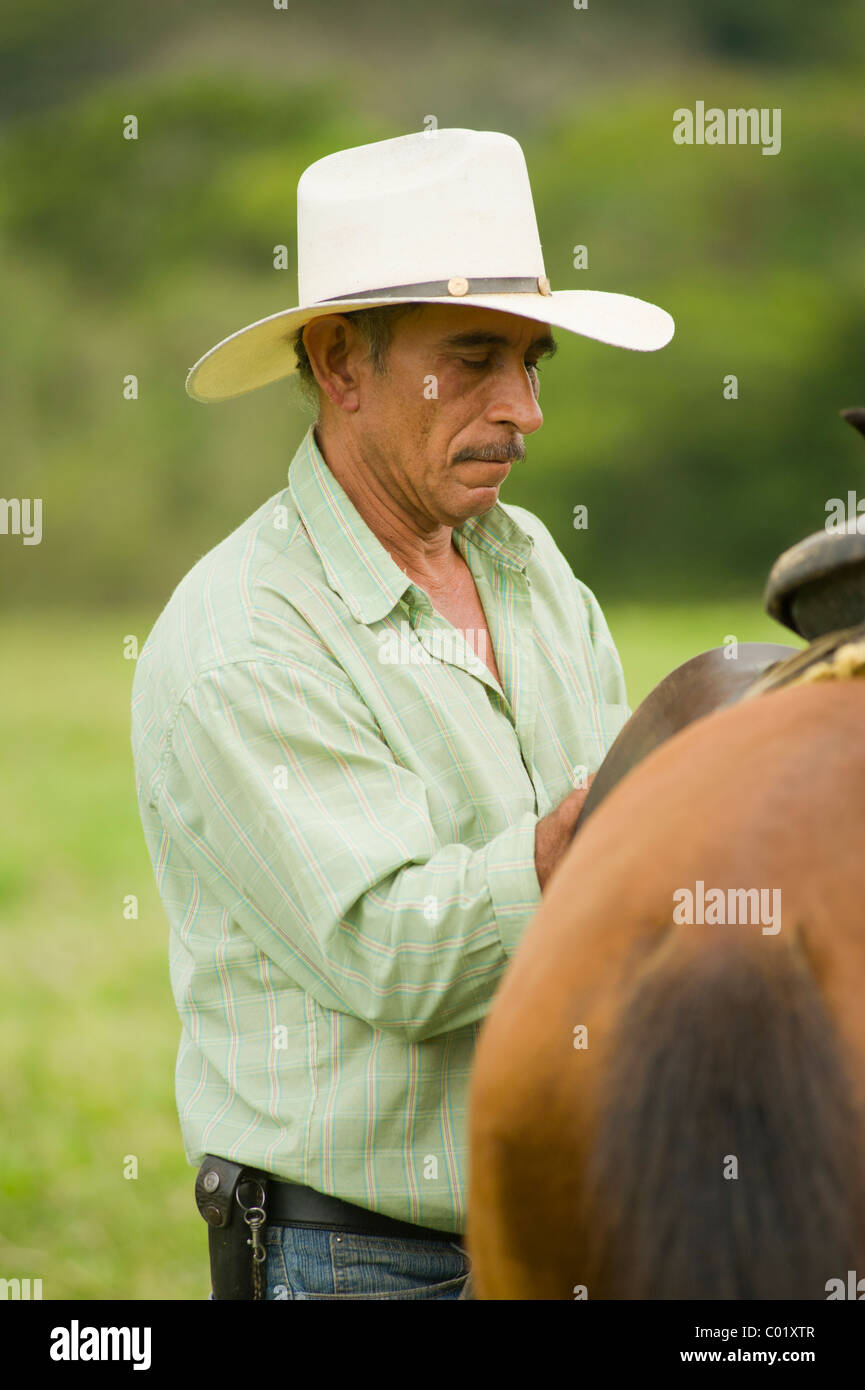 Don Arnulfo, rancher working with his horse at the Finca El Cisne ranch in Copán, Honduras. Stock Photo