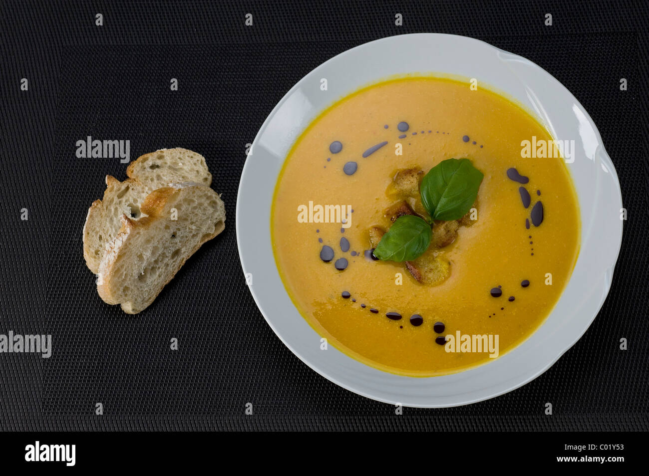 Pumpkin cream soup with croutons Stock Photo