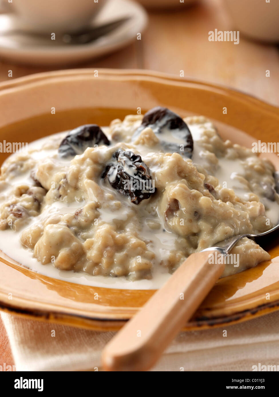 Individual portion of porridge and fruit vegetarian breakfast Stock Photo