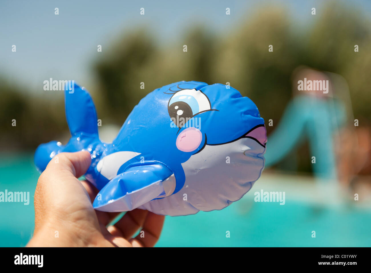 Floating fish toy near the swimming pool Stock Photo - Alamy