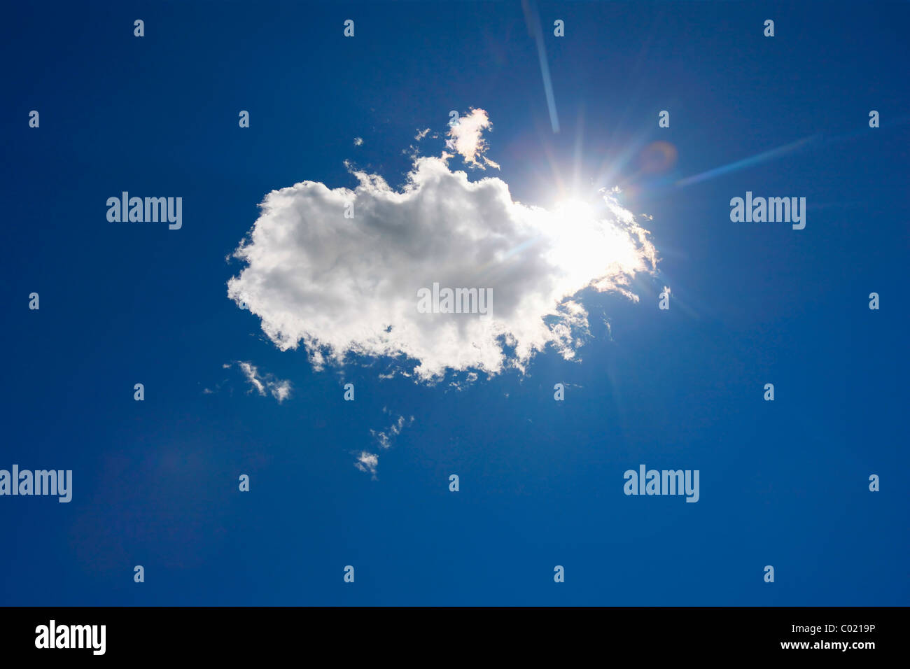 Sun hiding behind the cloud. Stock Photo