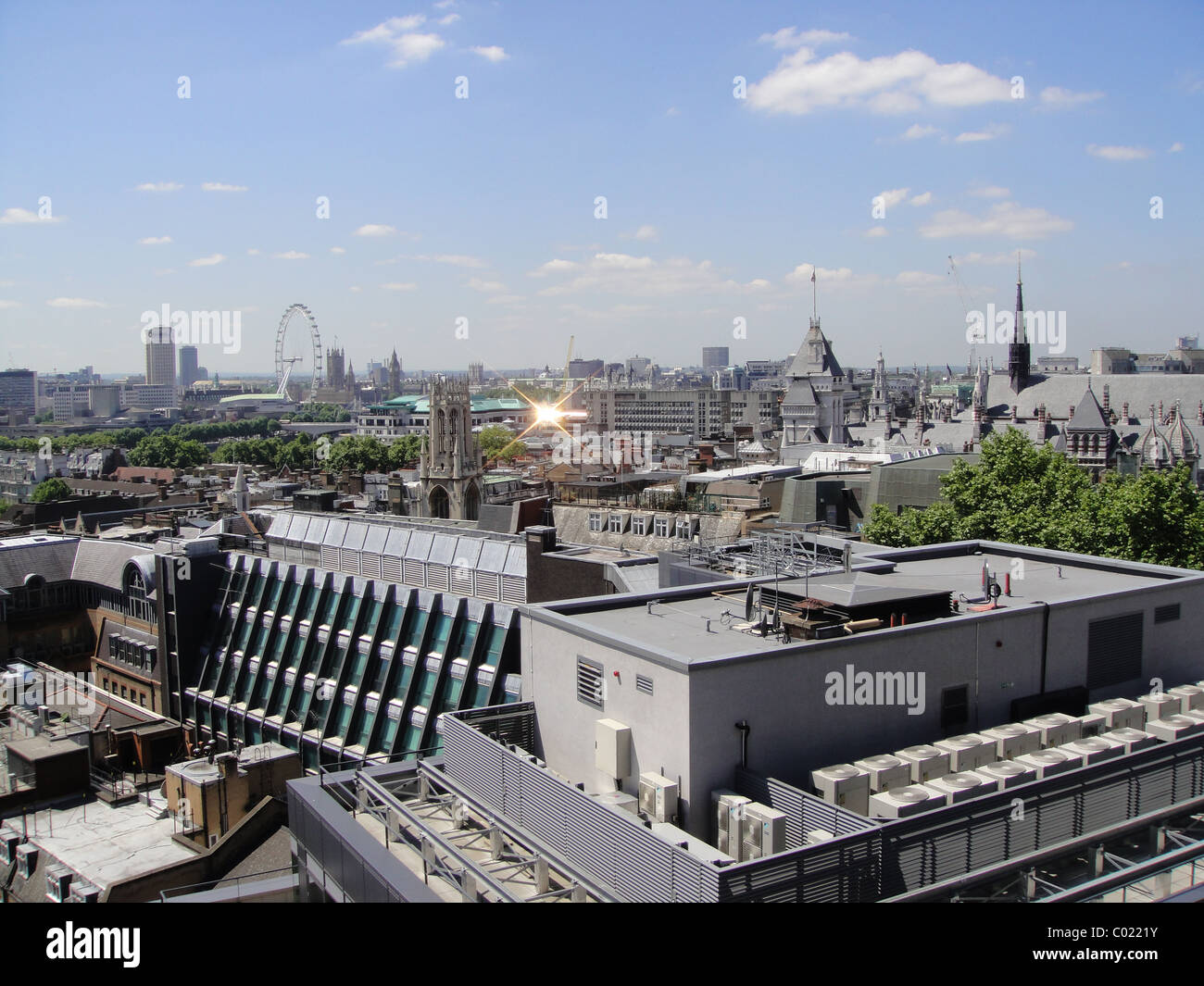Rooftops of the City of London on a sunny day towards South Bank, the London Eye and the Houses of Parliament Stock Photo
