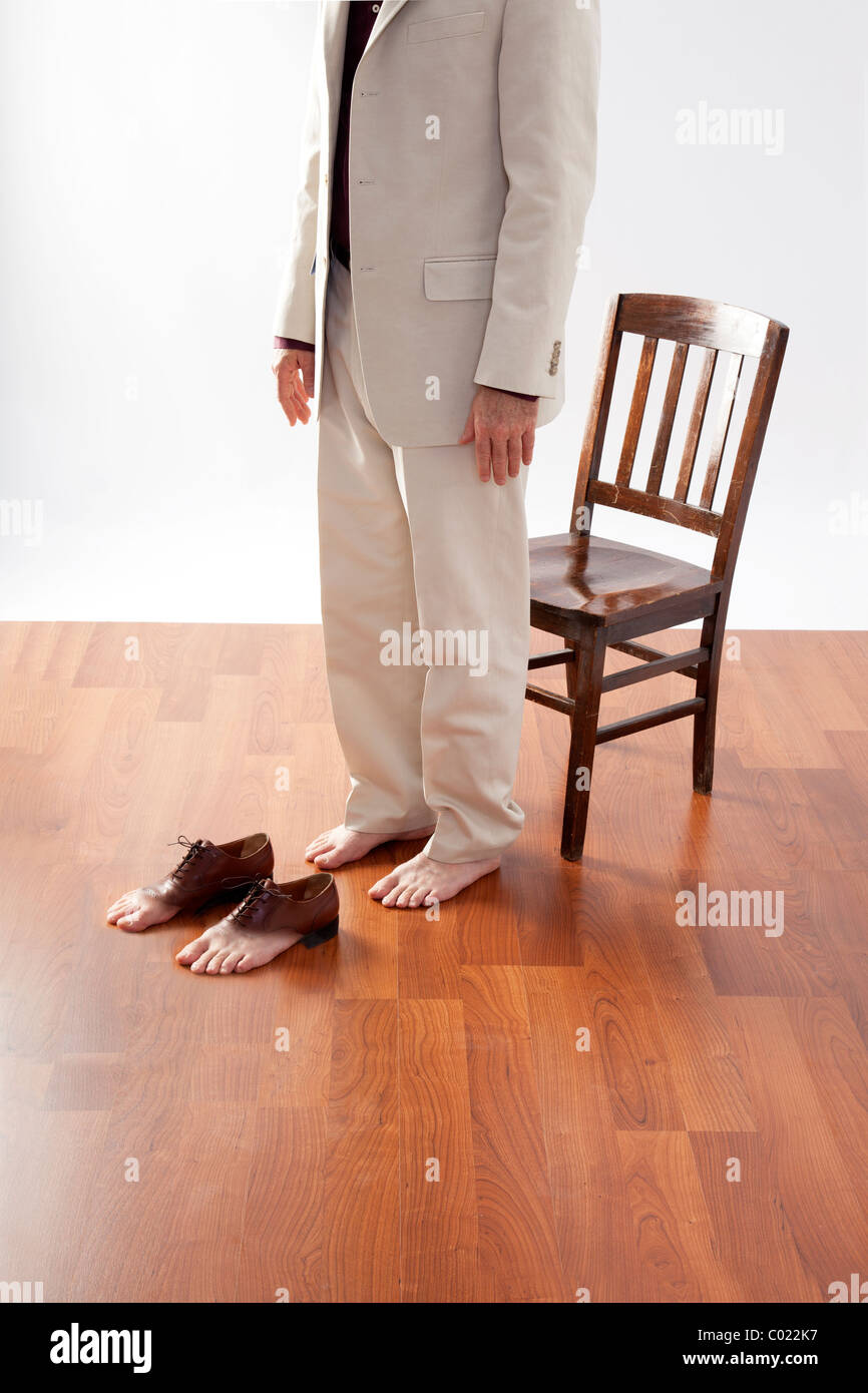 man about to put on shoes with real toes Stock Photo
