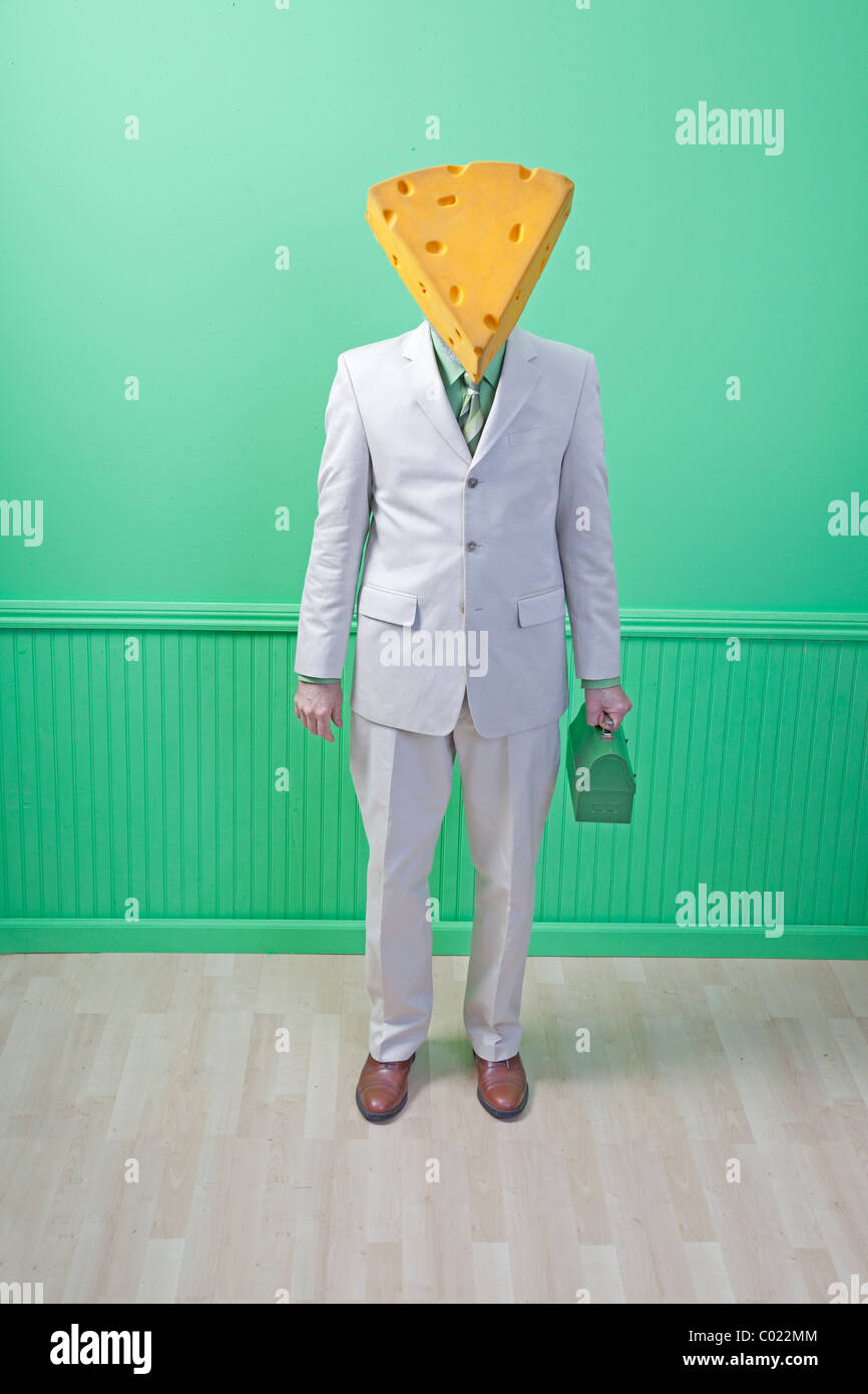 cheese head in suit with green lunch box Stock Photo