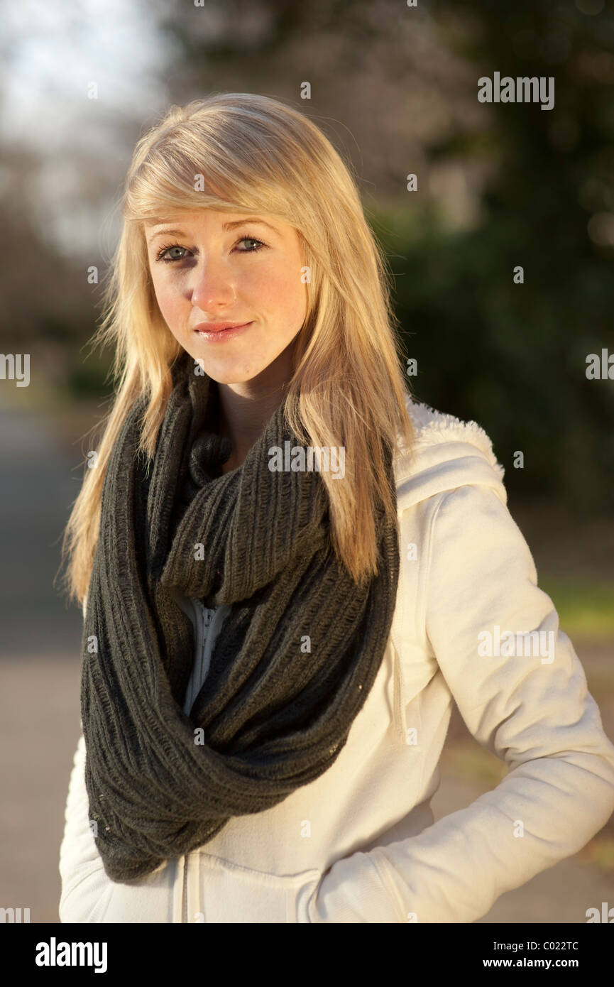 A Slim Blonde 14 Year Old Teenage Girl Standing Outside