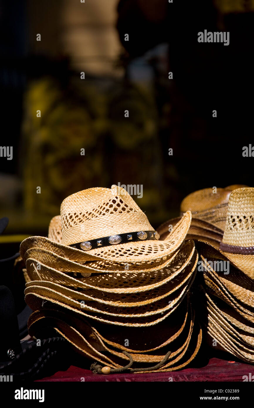 Display of raffia straw cowboy hats traditionally worn in hot weather Stock Photo