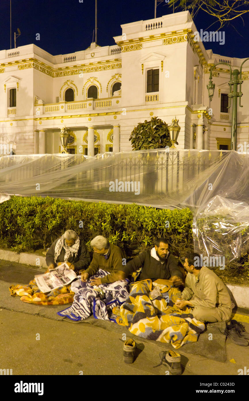 anti-Mubarak protestors camping outside parliament building at night, near Tahrir Square, Cairo, Egypt Stock Photo