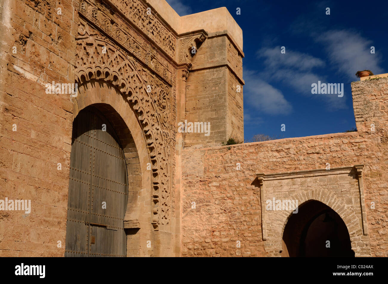 Red ochre stone arch of ancient Yacouh el Mansour Bab Oudaia entrance gate to Kasbah in Rabat Morocco Stock Photo