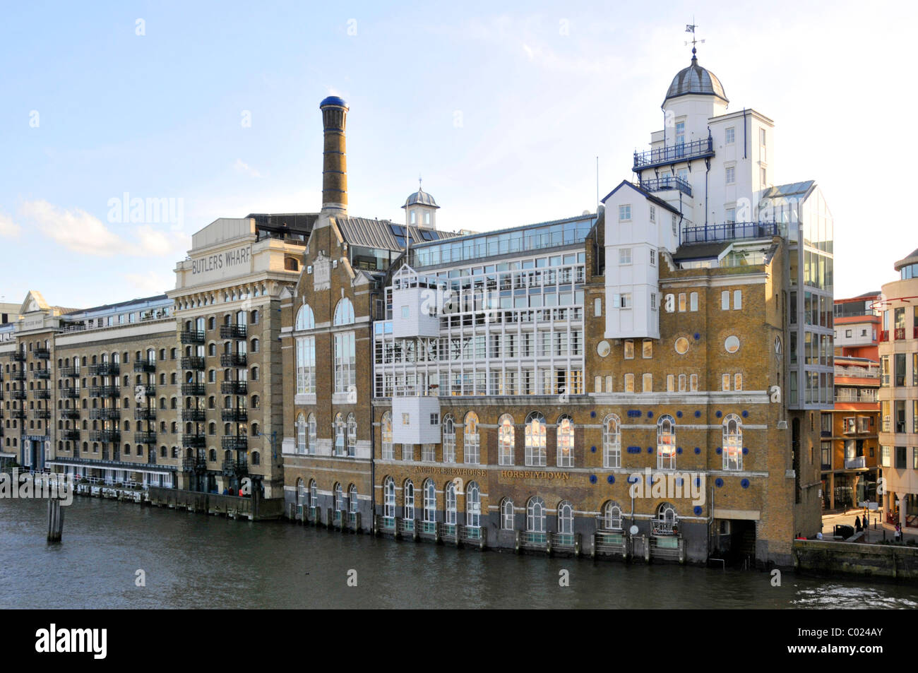 Butlers Wharf an English historic building converted into apartments from dockside warehouses beside River Thames Shad Thames Southwark London England Stock Photo