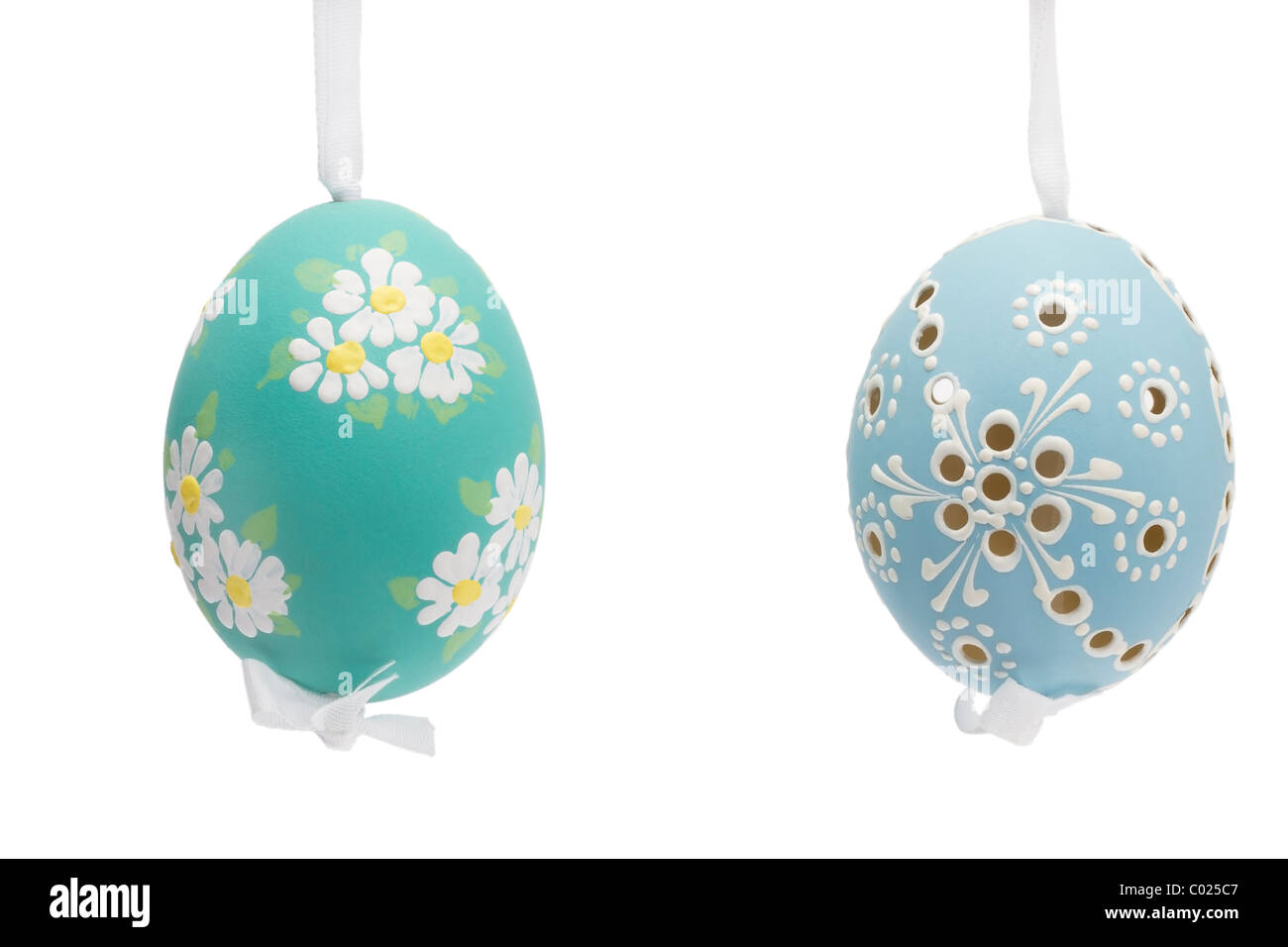 blue and green hanging hand painted easter eggs on white background Stock Photo