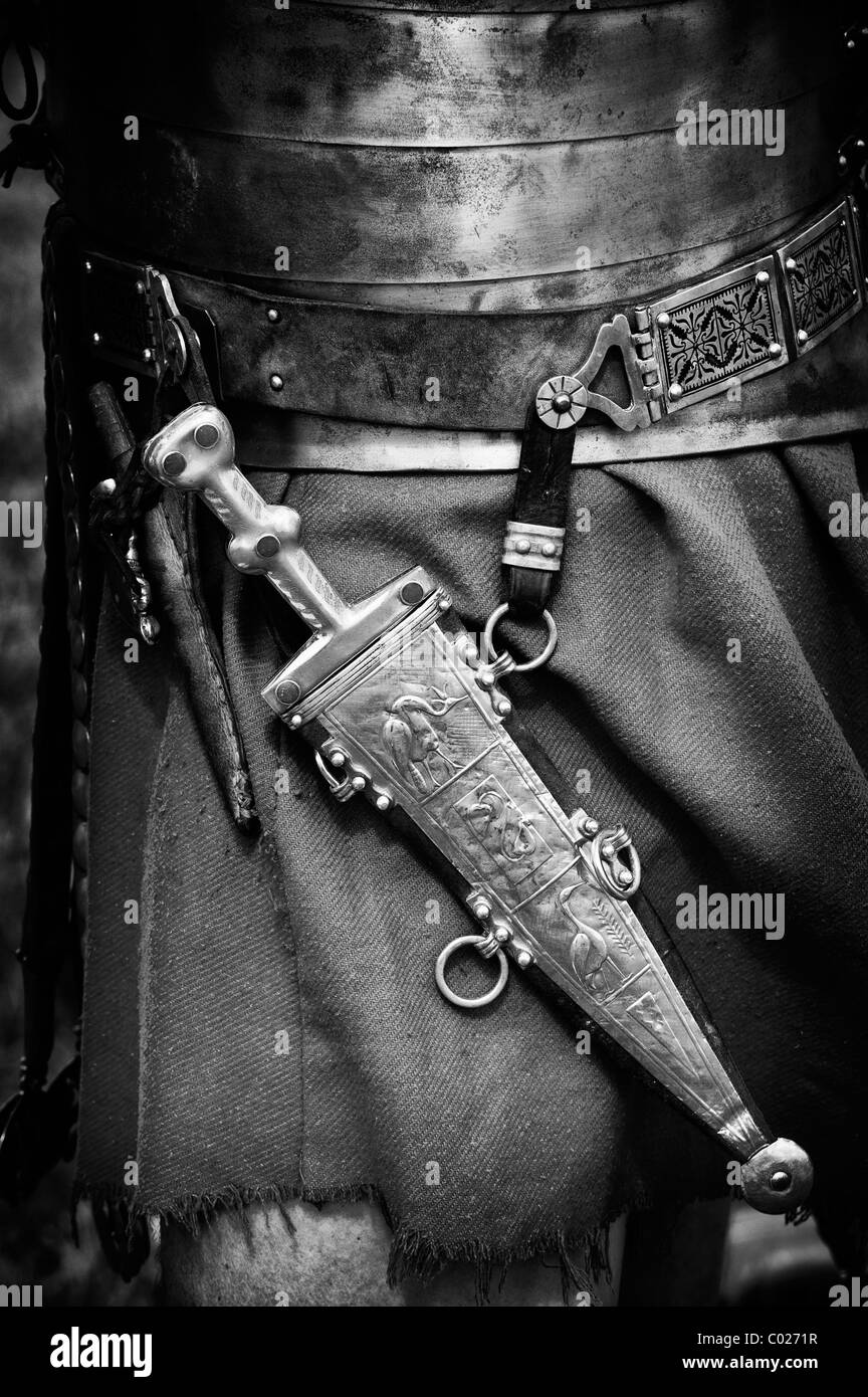 Roman soldiers pugio (small dagger) worn around the waste of a re-enacting roman soldier. Monochrome Stock Photo