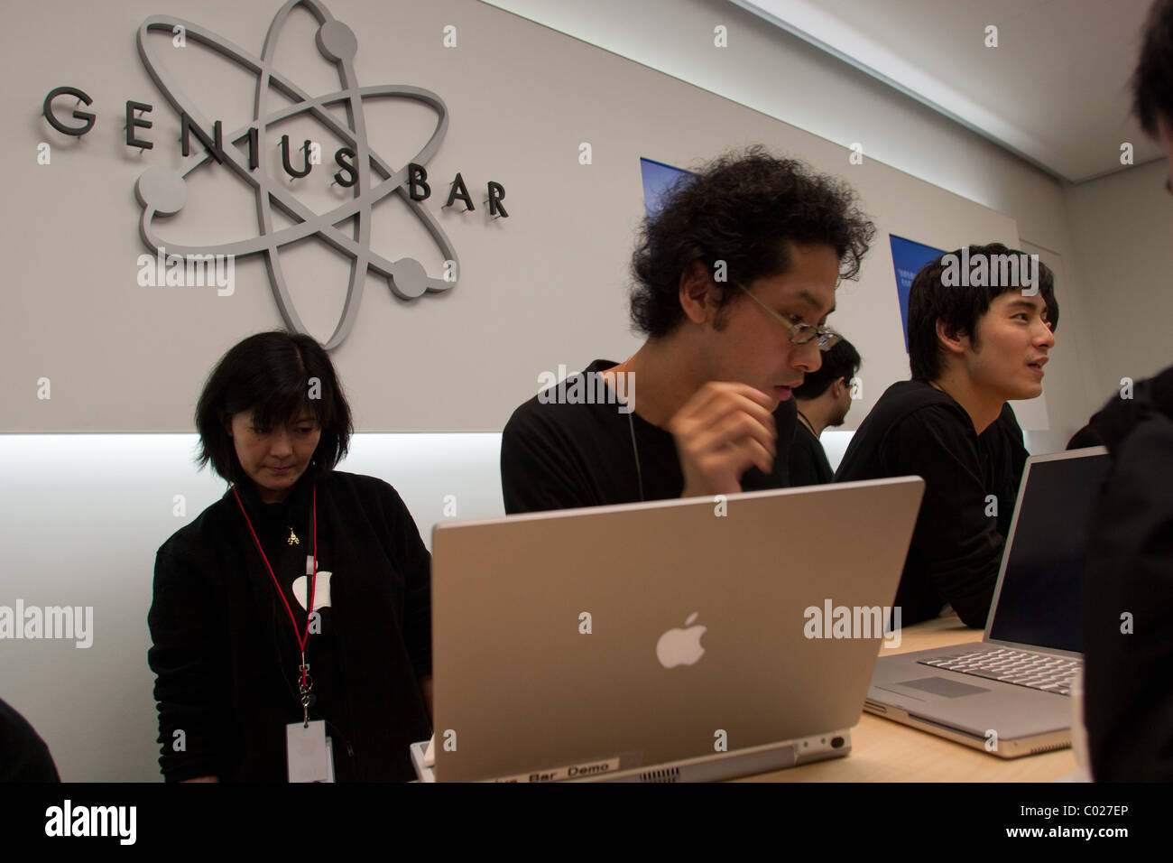 A Genius Bar Reservations Sign at an Apple Store in Front of the Genius Bar  Where Apple Employees are Helping Customers Editorial Stock Image - Image  of global, iphone: 237668444