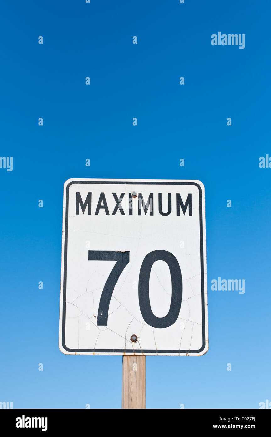 A traffic sign with a cracked surface reads Maximum 70 Stock Photo - Alamy