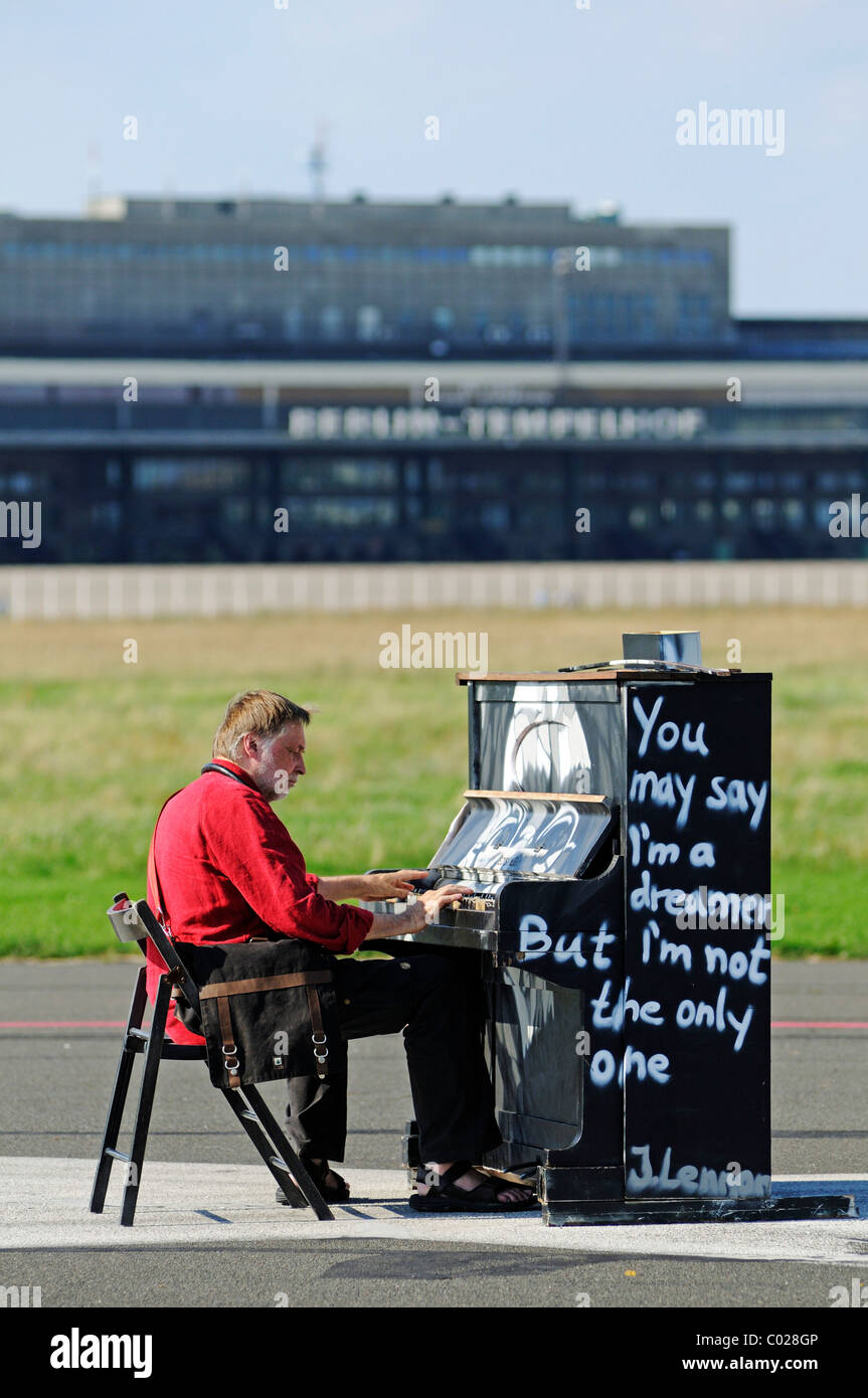Art installation with a piano and an image of John Lennon on the grounds of the former Tempelhof Airport, park opened in 2010 on Stock Photo