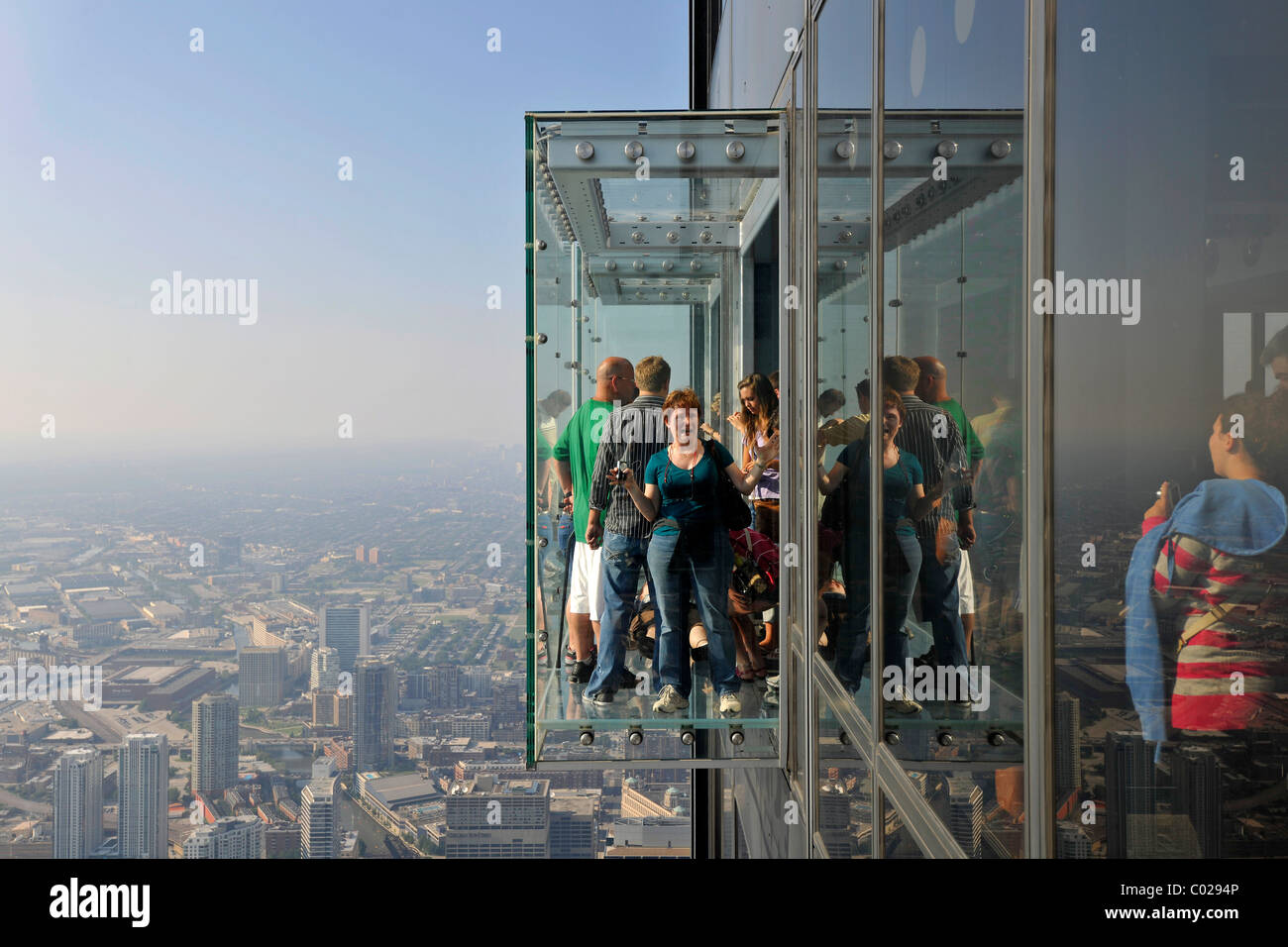 Visitors standing on the new 412-meter high Skydeck viewing platform, Willis Tower, formerly named Sears Tower and renamed in Stock Photo