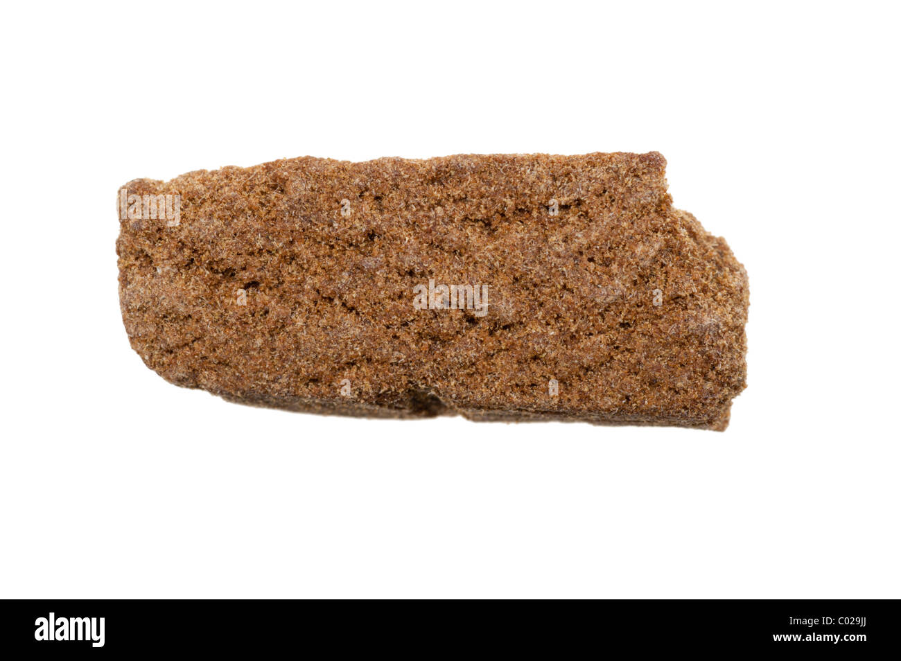 piece of hashish, photo taken with a macro lens, isolated on a white background Stock Photo