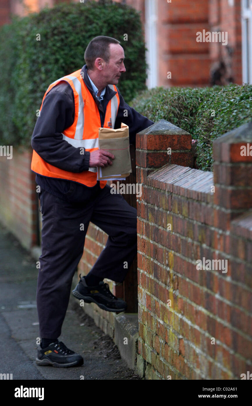 POSTMAN DELIVERING LETTERS Stock Photo