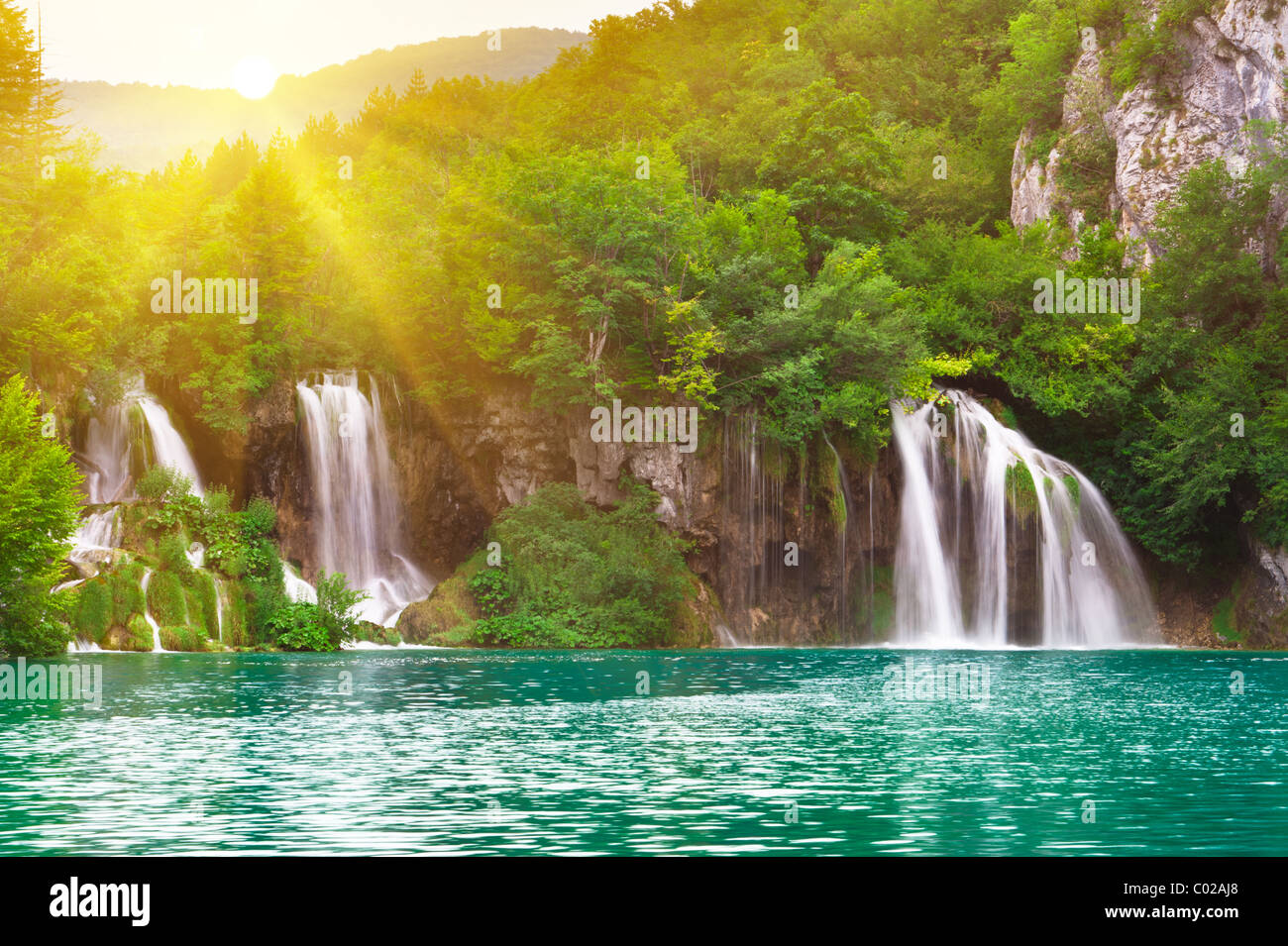 Waterfalls in national park in sun rays. Plitvice, Croatia Stock Photo