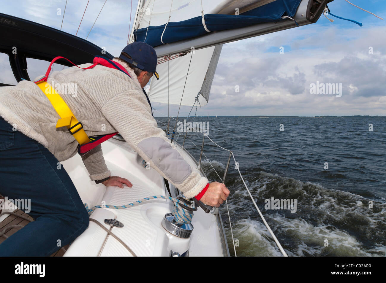 Sailor hauling the foresail Stock Photo