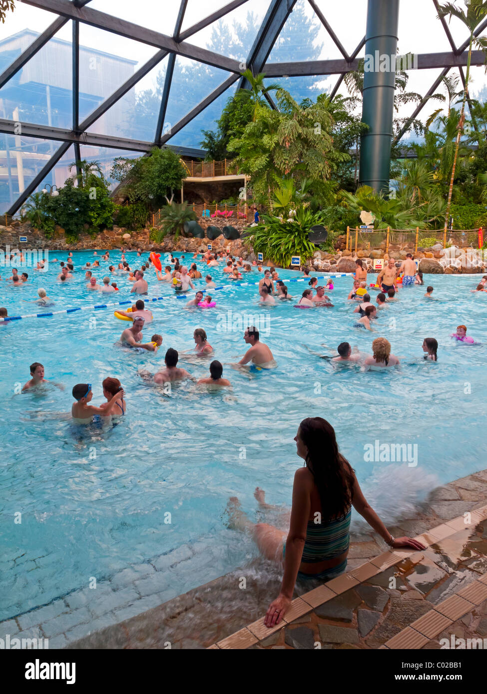People swimming in the large domed pool at Center Parcs Sherwood Forest near Rufford Nottinghamshire England UK opened in 1987 Stock Photo