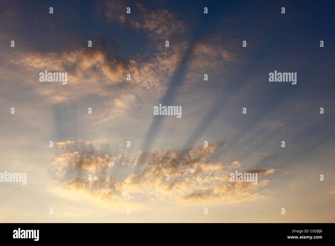 Sun rays in the cloudy sky, Ireland, Europe Stock Photo